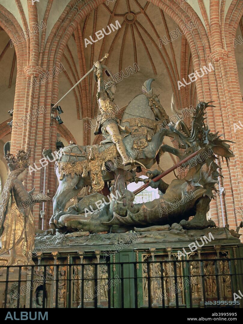 St George and the Dragon statue, inside the Storkyrkan Church, Stockholm, Sweden. The Storkyrkan (Great Church) is the oldest church in Gamla Stan, the old town of Stockholm. It is first mentioned in a written document dating from 1279. The statue is attributed to the German sculptor Bernt Notke and dates from 1489. It was commissioned to commemorate the victory of the Swedish regent Sten Sture at the Battle of Brunkeberg in 1471. The statue also serves as a reliquary and contains relics said to be of St George and two other saints.