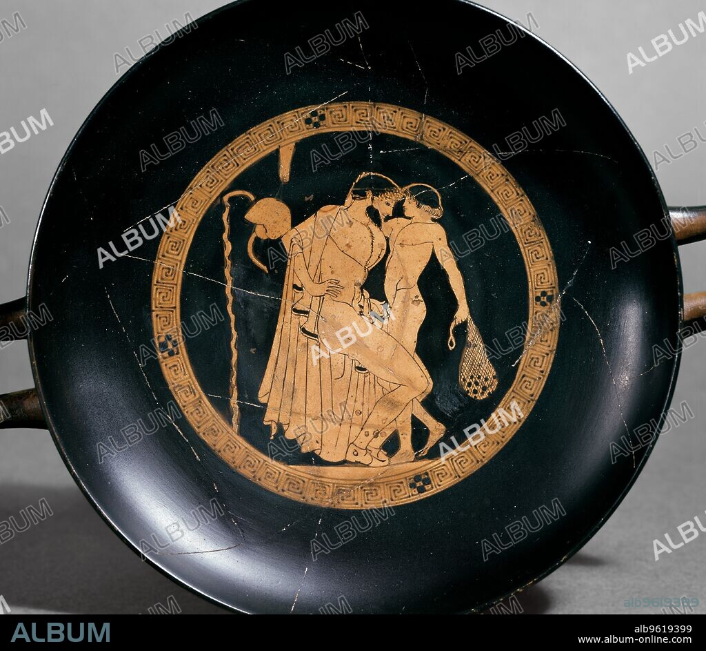 BRYGOS PAINTER. Attic red-figure cup showing a seated man with a naked boy in the inside tondo, 470 BC. Athenian red-figure cup; image of a seated man with a boy. Dimensions: height: 7.4 cmdiameter: 21.3 cm across handles.