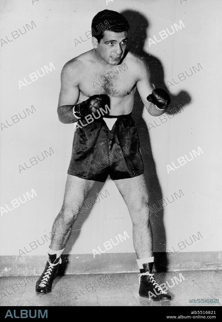 Top Lightweight Contender - Italian boxer Duilio Loi of Milan has been named top contender for the lightweight crown by Ping Magazine, the "Bible" of the boxing world. He has been champion of Europe and unbeaten since August of 1952. Loi replaces Jimmy Carter in the top slot as contender for Wallace "Bud" Smith's title. It is the first tine in 24 years that a European has been named top lightweight contender by the magazine. December 10, 1955. (Photo by United Press Photo).