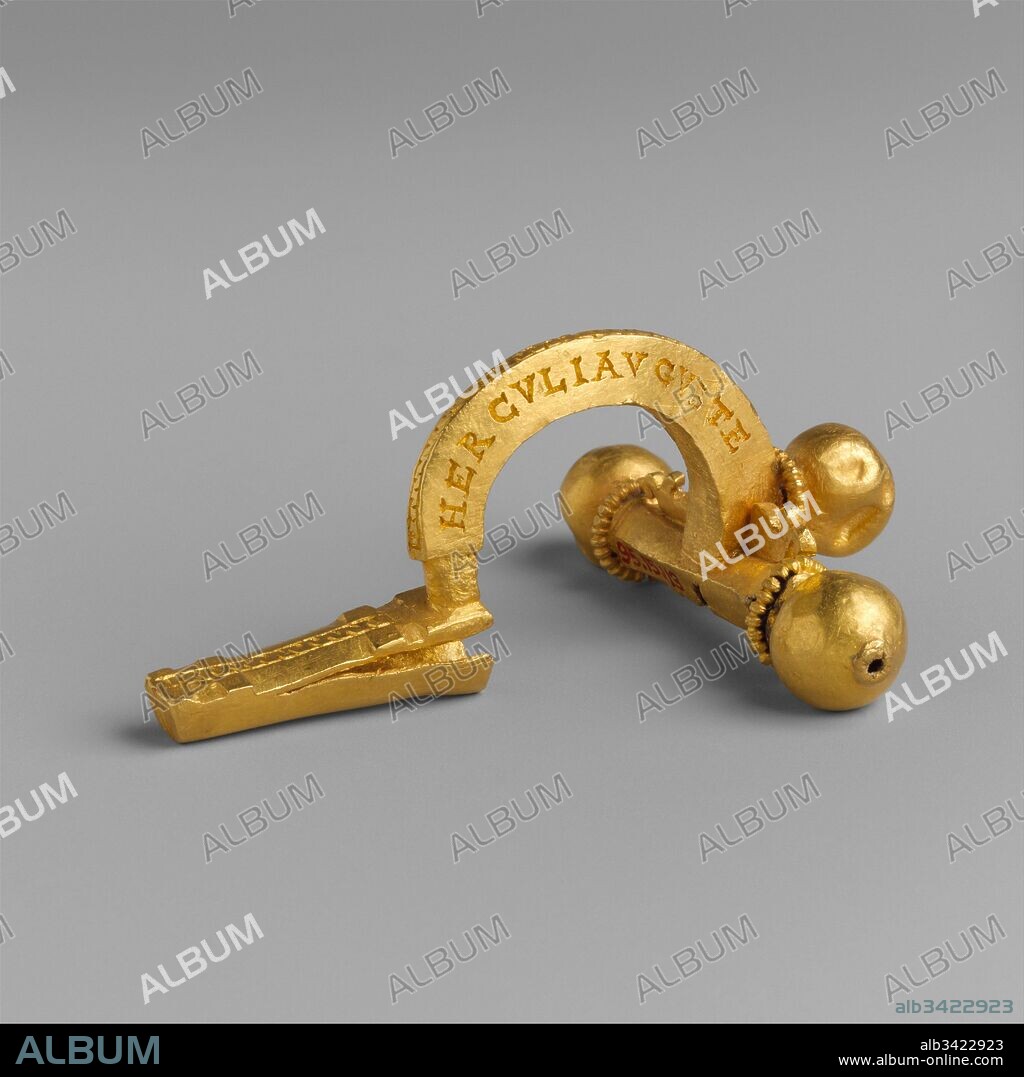 Gold crossbow fibula (brooch), Late Imperial, Tetrarchic, ca. A.D. 286–306/7 or 308/9, Roman, Gold, 2 1/8in. (5.4cm), Gold and Silver, This type of fibula, used to fasten a cloak around the neck, became part of the standard insignia of military personnel during the third century A.D. This example is inscribed in Latin on the bow: HERCVLI AVGVSTE SEMPER VINCAS (May you always be victorious, Hercules Augustus!); the titles probably refer to the tetrarch Maximian, who styled himself as Hercules.