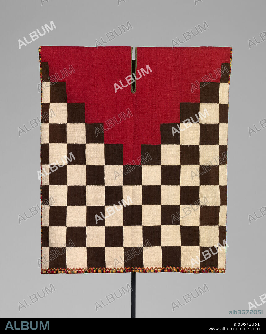Votive Checkerboard Tunic. Culture: Inca. Dimensions: H. 20 5/8 × W. 16 1/2 in. (52.4 × 41.9 cm). Date: 1460-1626.
This small tapestry-woven tunic features a checkerboard pattern with a red V-shaped yoke. Although the design follows the conventions of full-sized garments thought to be associated with the Inca military, its scale suggests that it was destined to adorn a votive figure, a custom practiced in both Inca and colonial Spanish contexts. According to the Spanish chronicler Juan de Betanzos, the Inca dressed certain sacred statues, sometimes the size of a child, in finely woven garments. Miniature checkerboard tunics, smaller than the present example, have been found with small gold, silver, and shell figurines as part of <i>capac hucha</i> or "ritual obligation" offerings, a type of ritual practice designed to extend and unite the vast landscape of the Inca Empire. 
Despite its smaller scale, this garment includes all of the fine detailing of its full-size counterparts. The checkerboard design is on front and back, inside and out, with meticulously embroidered finished edges. Woven as a single panel with single-interlocking joins, the neck slit was held closed by a temporary weft yarn that was removed after the weaving was complete. Once the finished weaving was cut from the loom, all seams and selvage edges were completely covered with fine double-faced embroidery. The seams were concealed with a precisely repeated series of multicolored bands of different widths. As with the full-size versions, along the bottom, just above that embroidered edge, a discreetly proportioned zigzag was created with similarly colored yarns.
