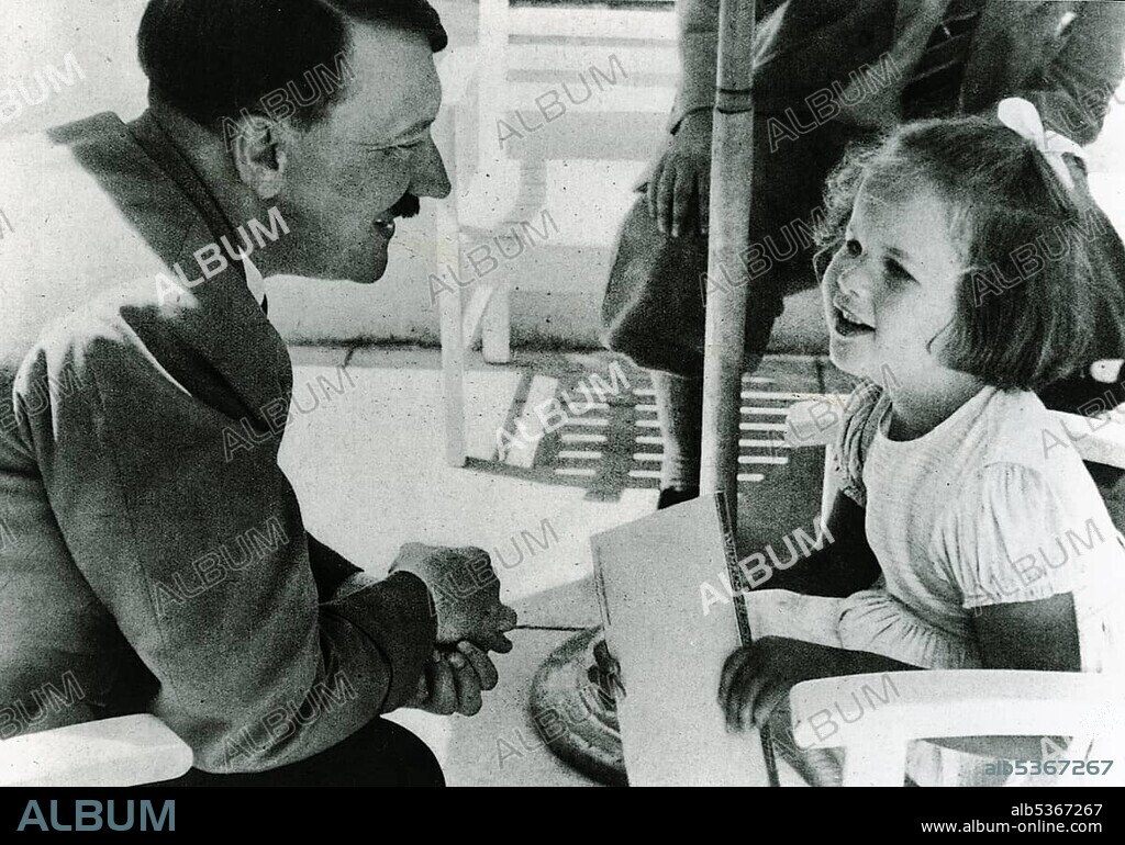 Adolf Hitler talking with a girl, historical photo circa 1937