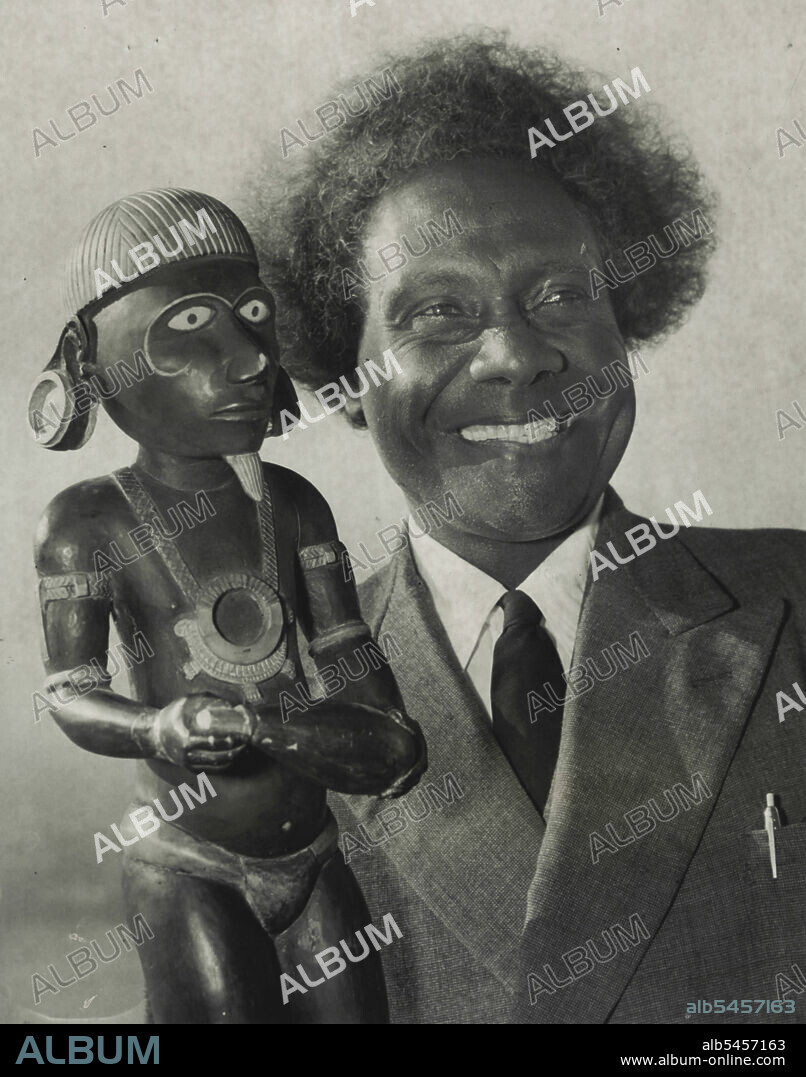 This idol, Kimbo, was worshipped by Solomon Islanders in cannibal days as a god of war.It was brought to Sydney today by Pastor Kata Ragoso, president of Western Solomons Seventh Day Adventist Mission and chief of the Marovo tribe, which saved 200 Allied airmen during the war.Pastor Ragoso, who is on his way home, arrived in Sydney today in the Oronsay, after attending a conference of his church in San Francisco.He is in charge of 4000 parishoners, 56 schools and two hospitals. June 28, 1954.