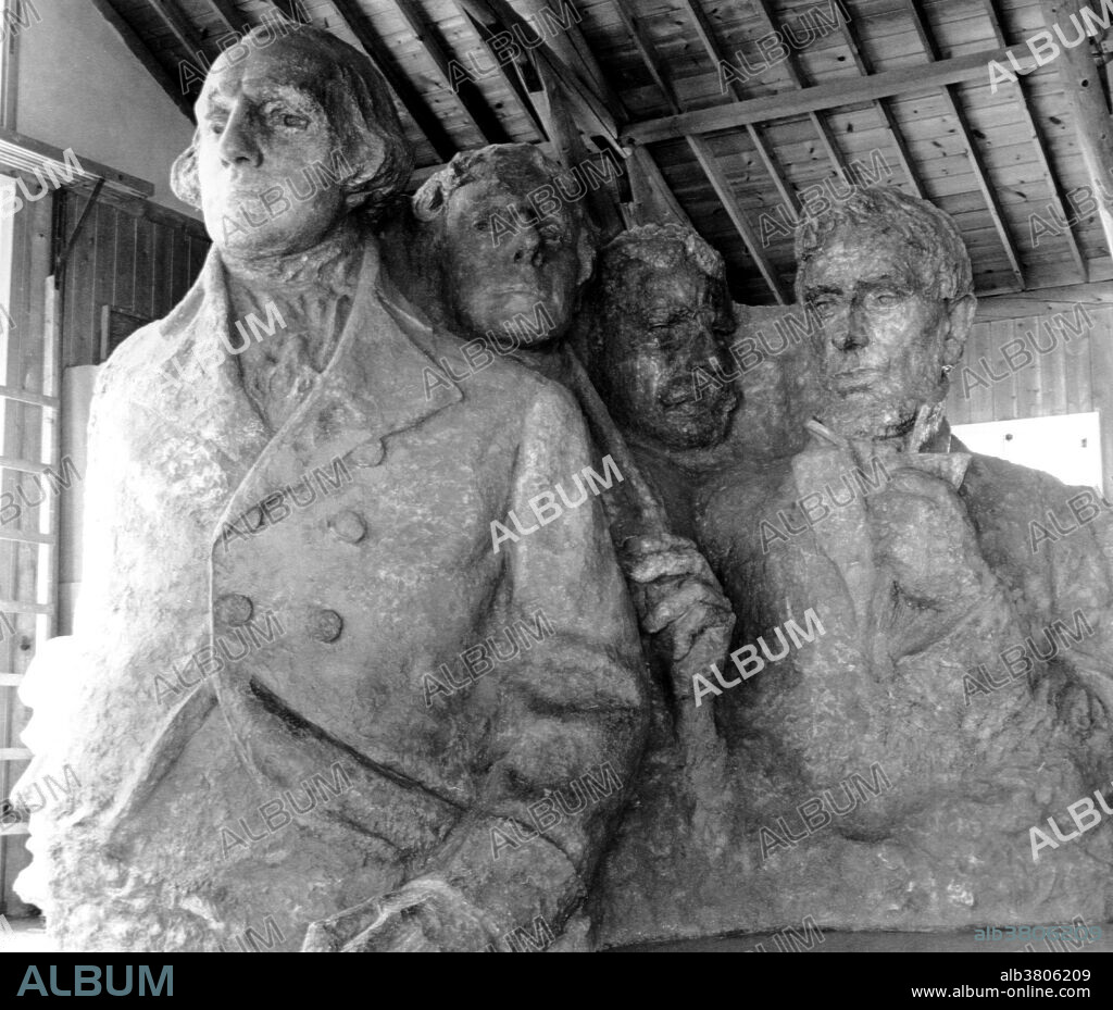 Final version of the plaster model used to carve Mount Rushmore located in the second studio at Mount Rushmore which was built in 1939 and finished in 1940. Mount Rushmore National Memorial is a sculpture carved into the granite face of Mount Rushmore near Keystone, South Dakota. Sculpted by Danish-American Gutzon Borglum and his son, Lincoln Borglum, Mount Rushmore features 60 foot sculptures of the heads of four United States presidents: George Washington, Thomas Jefferson, Theodore Roosevelt, and Abraham Lincoln. Construction on the memorial began in 1927, and the presidents' faces were completed between 1934 and 1939. Although the initial concept called for each president to be depicted from head to waist, lack of funding forced construction to end in late October 1941. Mount Rushmore has become an iconic symbol of the United States, and attracts over three million visitors annually. Lincoln Borglum Collection.