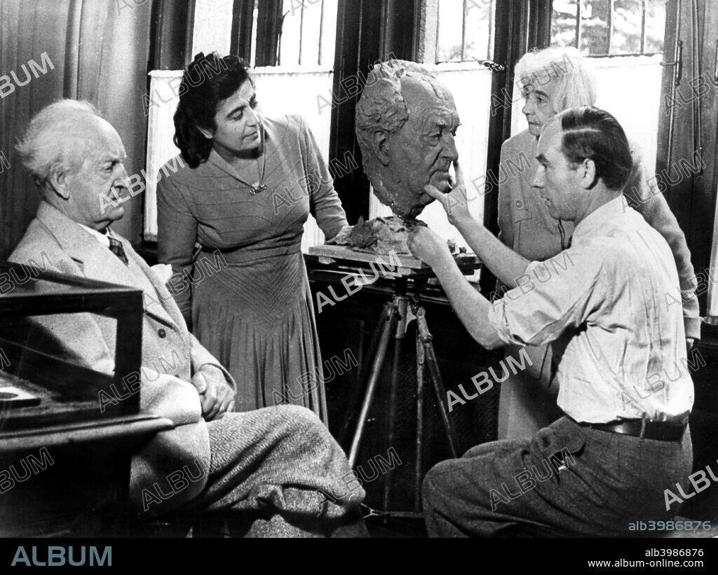 Arno Breker, German sculptor, working on a bust of Gerhart Hauptmann, 26 October 1942. The work of Breker was popular with several leading Nazis and Hitler in particular. He undertook numerous commissions for the regime. In 1942 he exhibited a show of his work in occupied Paris. Hauptmann was a German dramatist who won the Nobel Prize for literature in 1912.