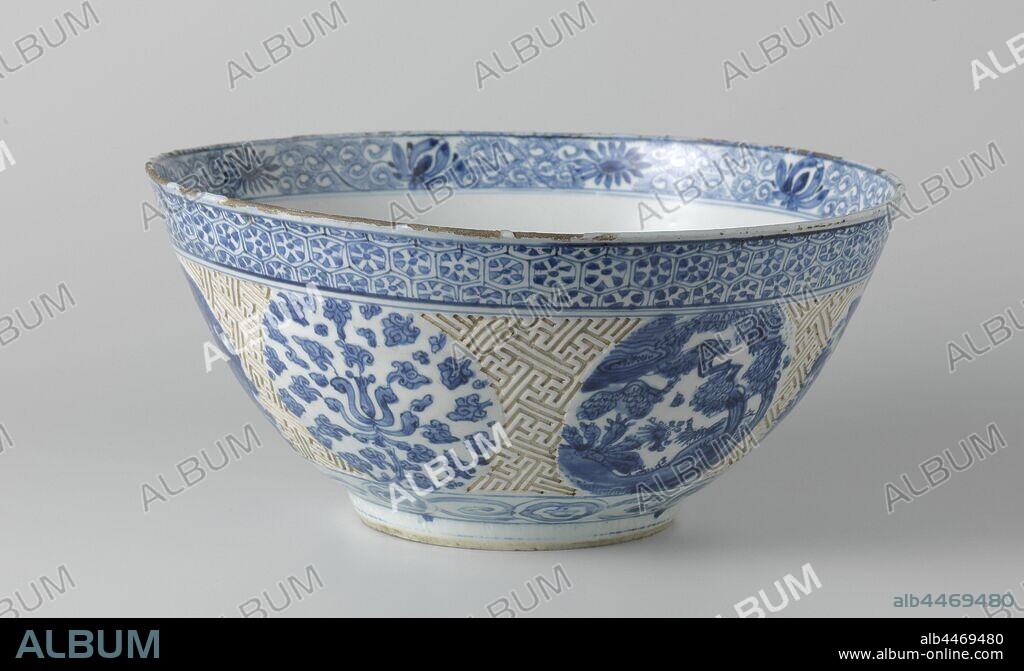 Bowl, Bowl with a swastika pattern, flowering plants and animals in landscapes, Bowl of porcelain, painted in underglaze blue. On the outer wall a wide band with a swastika pattern in relief. This saves six medallions with a duck in a landscape, flowering plants or flower vines. On the outside edge a band with napkin work, above the foot a band with ruyi motifs. On the bottom a medallion with a flower vase on a table on a terrace with a butterfly and clouds above it. The inner edge with different flower vines. Kraak porcelain in blue and white., Flowers, ornament, anonymous, China, c. 1625 - c. 1649, Ming-dynasty (1368-1644) / Qing-dynasty (1644-1912) / Tianqi-period (1621-1627) / Chongzhen-period (1628-1644) / Shunzhi-period (1644-1661), porcelain (material), glaze, cobalt (mineral), vitrification, h 16 cm d 36 cm d 15 cm.