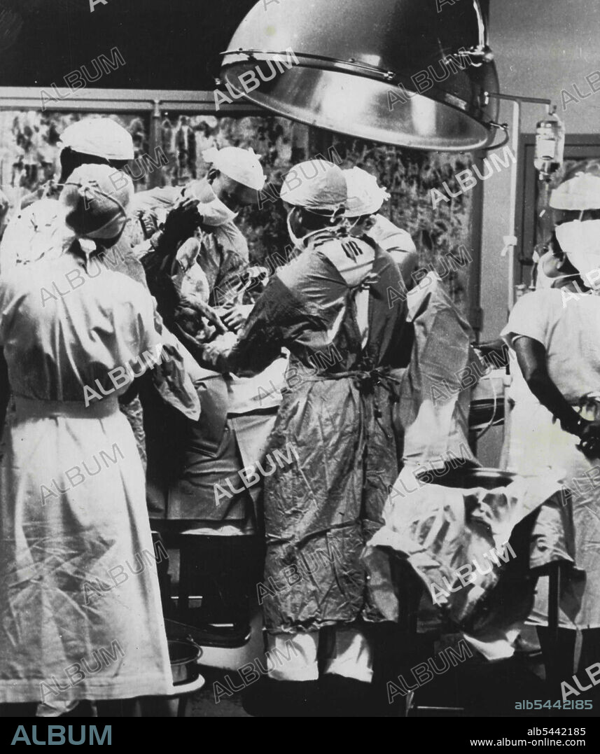 Birth of a baby televised -- Gordon Campbell Kerr was born, by caesarian section, to a young denver couple tonight as television audiences across the nation looked in on the hospital delivery room. The public saw the infant lifted from his mother, cleansed, wrapped in blankets and then heard his first cries. The history-making event was sponsored by a pharmaceutical firm during an American medical association meet. It was carried on 49 TV stations. December 2, 1952. (Photo by AP Wirephoto).