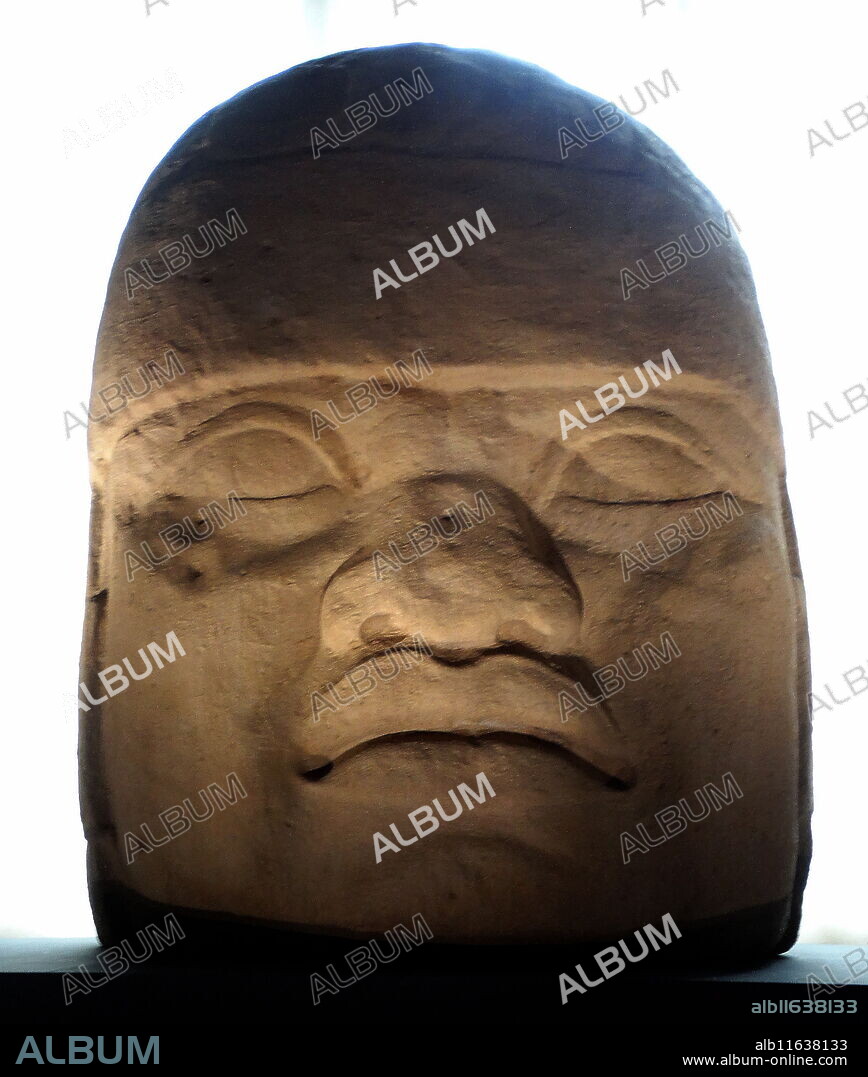 Olmec colossal heads are stone representations of human heads sculpted from large basalt boulders. They range in height from 1.17 to 3.4 metres (3.8 to 11.2 ft). The heads date from at least 900 BC and are a distinctive feature of the Olmec civilization of ancient Mesoamerica. All portray mature individuals with fleshy cheeks, flat noses, and slightly-crossed eyes; their physical characteristics correspond to a type that is still common among the inhabitants of Tabasco and Veracruz.