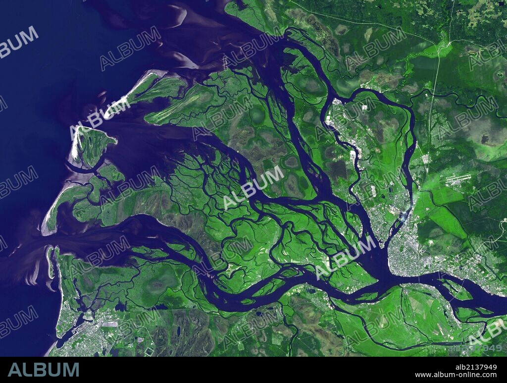 Arkhangelsk (or Archangel in English) is a city and the administrative capital of Archangelsk Oblast, Russia. It is situated on both banks of the Dvina River near where it flows into the White Sea. July 14, 2010. Satellite image. (Photo by: Universal History Archive/UIG via Getty Images).