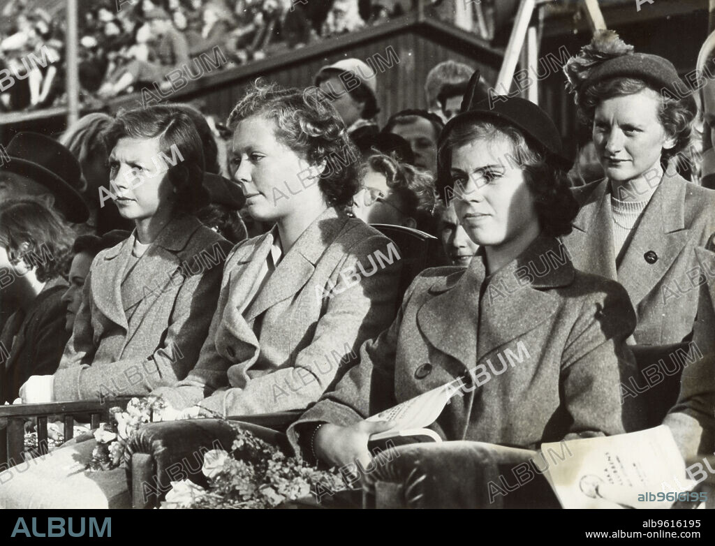 Princesses Desiree, Birgitta and Margaretha of Sweden at a dog show, Stockholm, 1950. Princess Desiree (1938-), Princess Birgitta (1937-) and Princess Margaretha (1934-), the three eldest children of Prince Gustaf Adolf, Duke of Västerbotten and Princess Sibylla of Saxe-Coburg and Gotha. From the collection of Svenskt Fotoreportages.