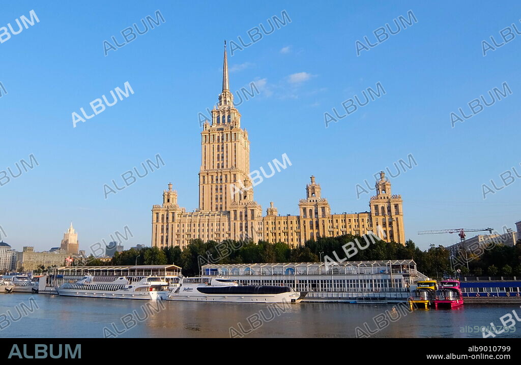 Hotel Ukraina, Moscow is a five-star luxury hotel in Moscow city centre, on a bend of the Moskva River. Hotel Ukraina was commissioned by Joseph Stalin. It was designed by Arkady Mordvinov and Vyacheslav Oltarzhevsky (leading Soviet expert on steel-framed high-rise construction), and is the second tallest of the neoclassical Stalin-era "seven sisters".