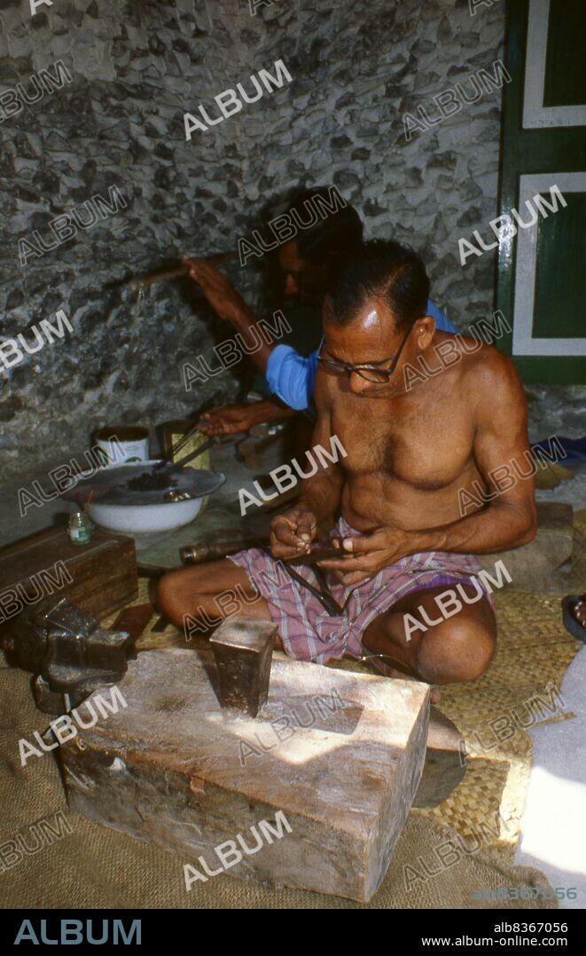 On the eastern rim of the South Nilandhoo Atoll lies the tiny island of Rinbudhoo. Here, in one of the quietest and cleanest villages in the Maldives, lives the country's only group of hereditary goldsmiths. Melting down Victorian gold sovereigns and Marie-Therèse thalers as casually as recently-imported mini-ingots from Dubai, they manufacture an exquisite range of chains, necklaces, ear-rings, finger-rings and amulets.<br/><br/>. Asia's smallest and least-known nation, the Republic of Maldives, lies scattered from north to south across a 750-kilometre sweep of the Indian Ocean 500 kilometres south-west of Sri Lanka. More than 1000 islands, together with innumerable banks and reefs, are grouped in a chain of nineteen atolls which extends from a point due west of Colombo to just south of the equator.