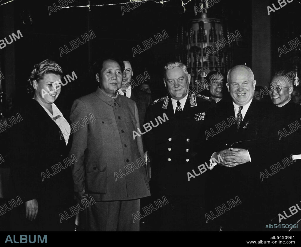 Bulganin And Khrushchev Meet Mao -- Marshal Bulganin (centre), new Prime Minister of the Soviet Union, Photographed with Mao Tse-tung, ruler of Communist China, and Nikita khrushchev (right), Secretary General of the communist party of the U.S.S.S.R., in Peking. Photograph was taken at a reception given by the Soviet Ambassador to China, P.F. Yudin, to a Soviet Delegation ***** China to partake in the Chinese national day *****. At left (holding hands with Mao) is E.A. ***** member of the Soviet delegation; between ***** Khrushchev is chou Enplai, Prime Minister ***** China. March 03, 1955. (Photo by Camera Press).