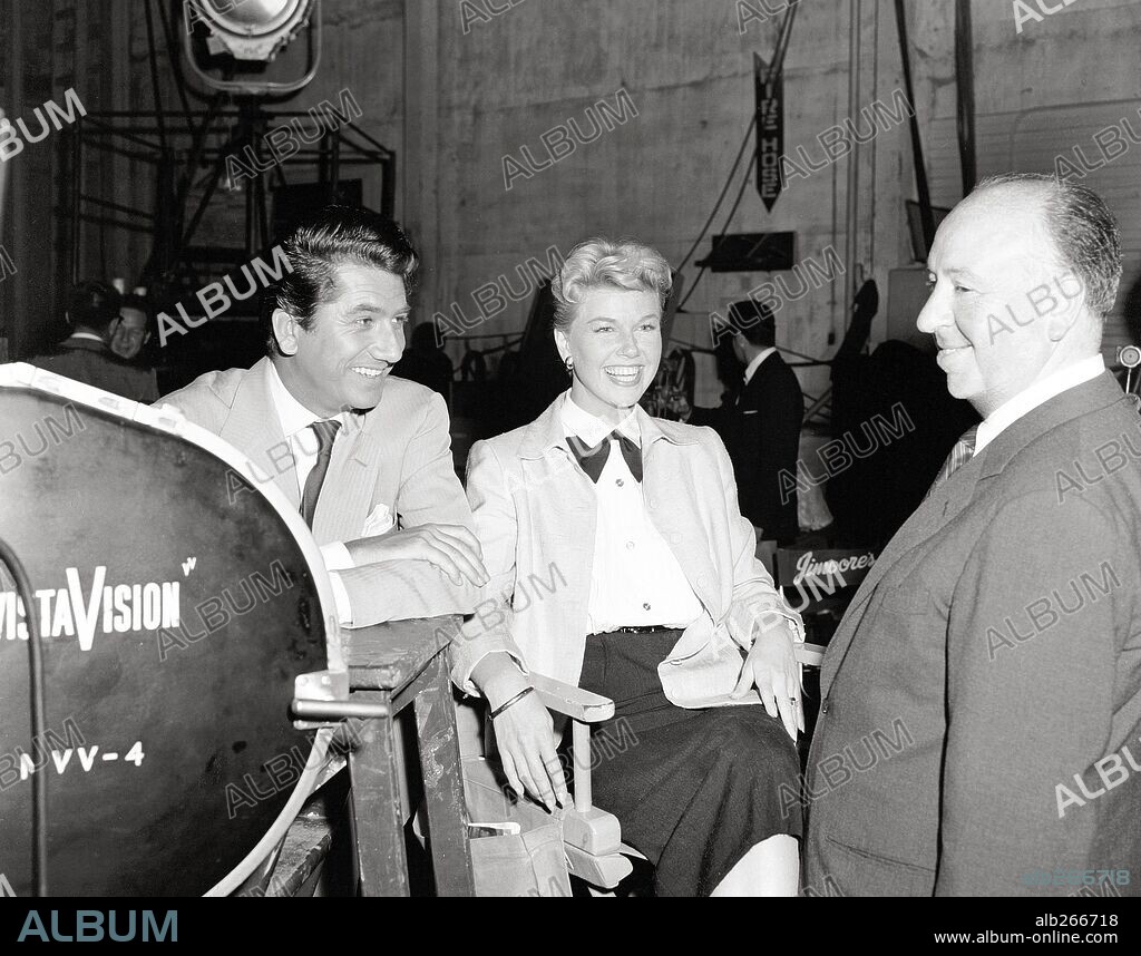 ALFRED HITCHCOCK, DANIEL GELIN and DORIS DAY in THE MAN WHO KNEW TOO MUCH, 1956, directed by ALFRED HITCHCOCK. Copyright PARAMOUNT PICTURES.