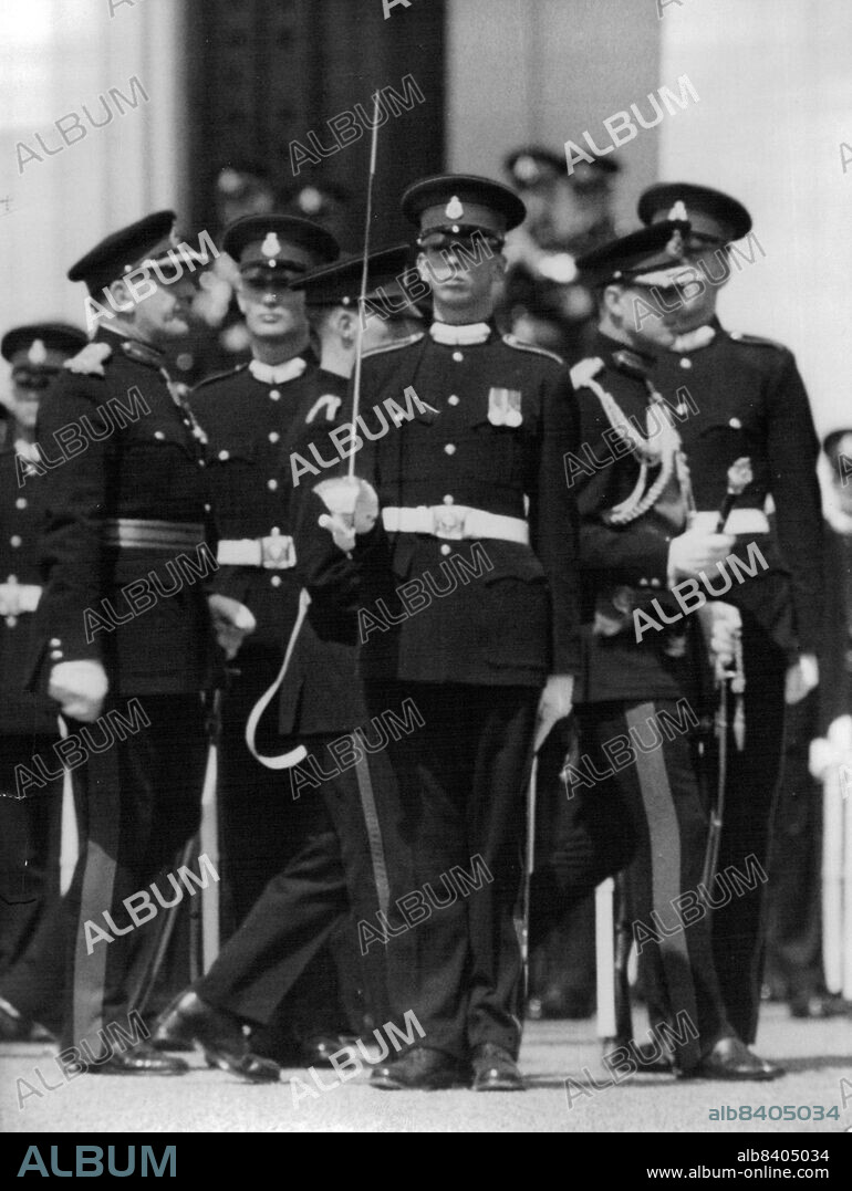 Dukes at Sandhurst Parade - The Duke of Edinburgh, wearing his uniform as a Field Marshal, walks behind the Duke of Kent, who was on parade as an under officer at Sandhurst today (Thursday) for the Royal Military Academy's Sovereign's Parade.The Duke of Edinburgh was representing the Queen at the parade, at which officer cadets, including the Duke of Kent, were passing out from the College.The young Duke become a second lieutenant at midnight. July 28, 1955. (Photo by Reuterphoto).