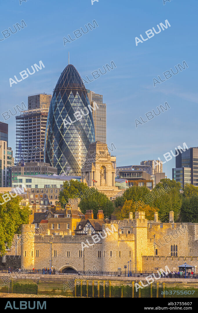 Tower of London, UNESCO World Heritage Site, and the Gherkin (30 St. Mary Axe), City of London, London, England, United Kingdom, Europe.