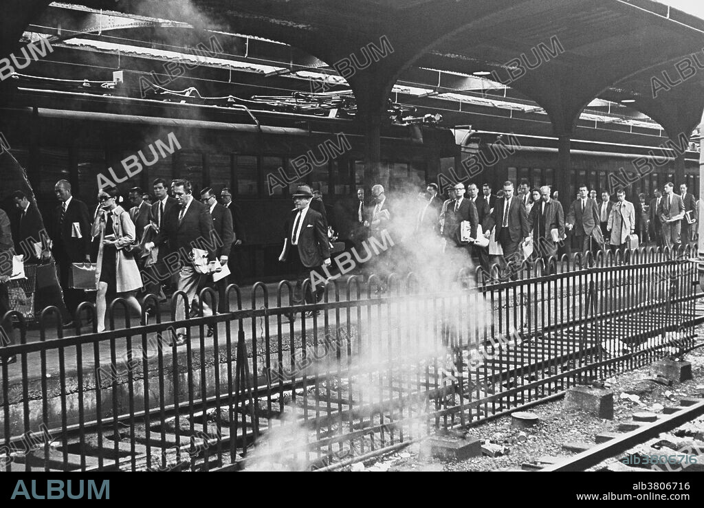 Commuters getting off the train at Lackawanna-Erie railway station in Hoboken, New Jersey, circa 1970s. Note that most of the commuters are white and male, with women numbering only four in the workforce shown here.
