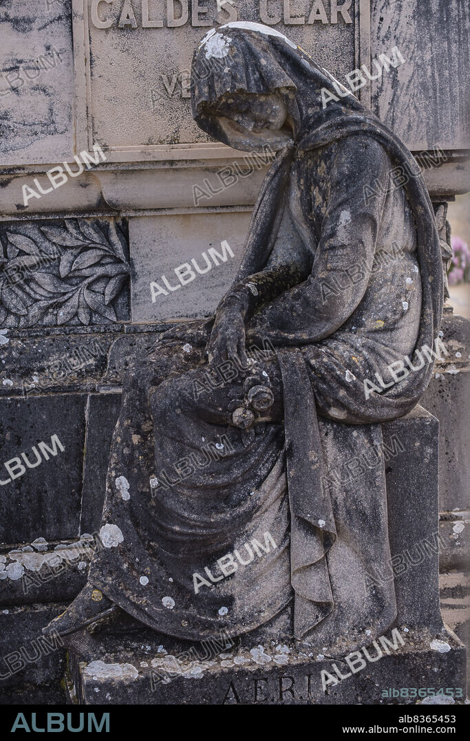 sculpture of a weeping woman in mourning, grave of Caldes Clar de Vernisa family, Llucmajor cemetery, Mallorca, Balearic Islands, Spain.