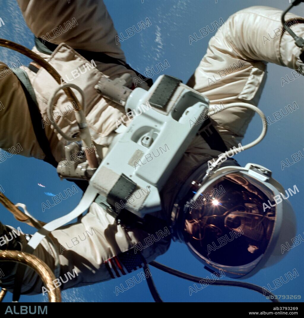 Astronaut Edward H. White II, pilot of the Gemini IV four day Earth-orbital mission, floats in the zero gravity of space outside the Gemini IV spacecraft. White wears a specially designed spacesuit; and the visor of the helmet is gold plated to protect him against the unfiltered rays of the sun. He wears an emergency oxygen pack, also. He is secured to the spacecraft by a 25 feet umbilical line and a 23- eet tether line, both wrapped in gold tape to form one cord. In his right hand is a Hand-Held Self-Maneuvering Unit (HHSMU) with which he controls his movements in space. Astronaut James A. McDivitt, command pilot of the mission, remained inside the spacecraft.