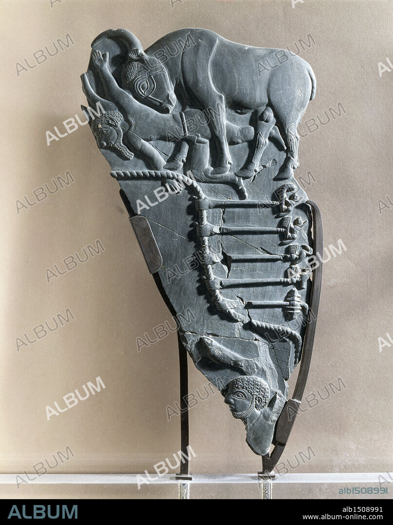 Egyptian civilization, Predynastic Period. Naqada culture. Schist cosmetic palette representing the victory of the king portrayed as a bull. Verso.