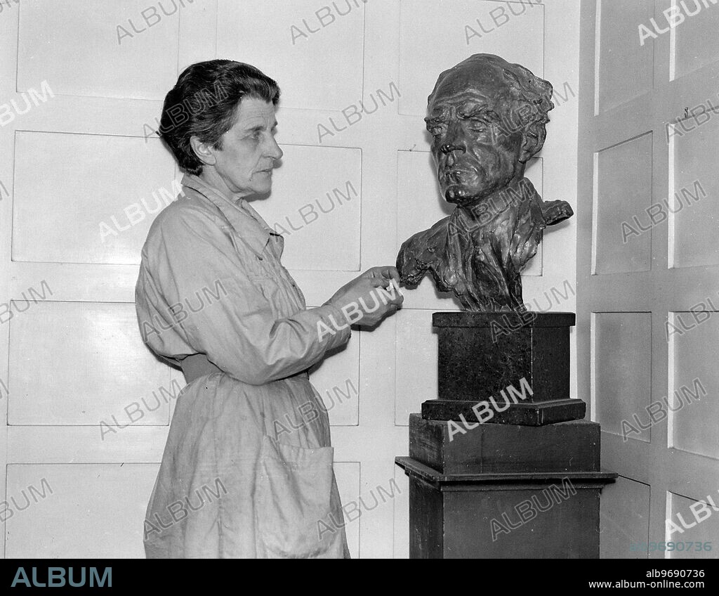 A new series of photographs of Lady Hilton Young at work in her studio in Bayswater . Lady Hilton Young was the widow of Captain Robert Falcon Scott, the antarctic explorer. 26 March 1931.
