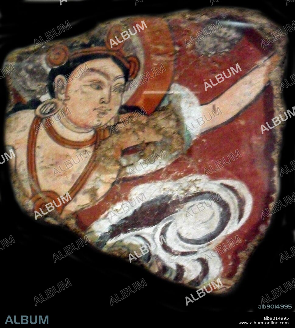 Fragment of wall painting showing the flying Apsara An Apsara also known as Vidhya Dhari, is a female spirit of the clouds and waters in Hindu and Buddhist mythology. 2nd century, Central Asia, Duldur Aqûr-site in China.