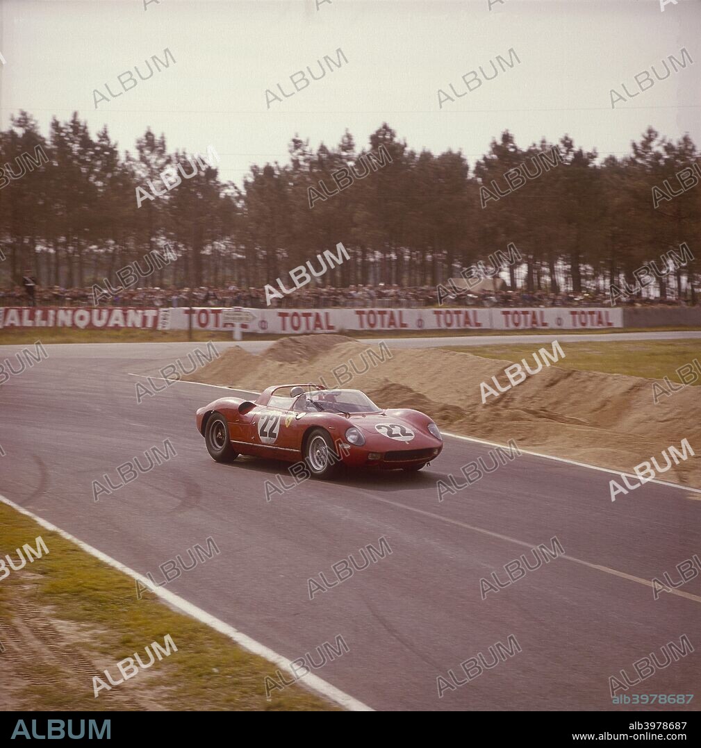 A Ferrari 250 P at Le Mans, France, 1963. The driver is either Mike Parkes or Umberto Maglioli. They came third in a Prototype class. Parkes joined Ferrari in 1963 as a test and development engineer, and was promoted to the Formula 1 team after the departure of John Surtees just before the 1966 Le Mans race. Magioli competed as an occasional reserve driver for the Ferrari factory team.