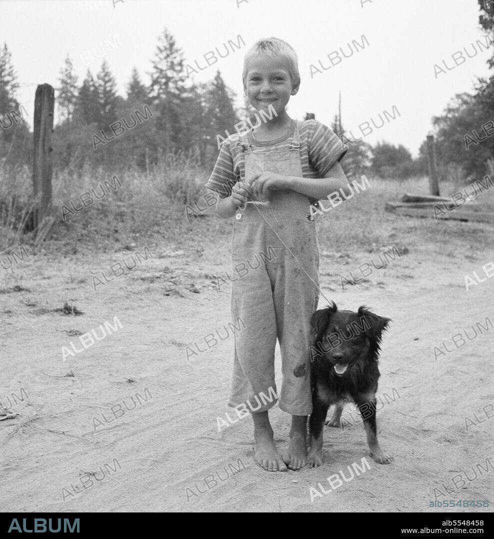 DOROTHEA LANGE. Oregon. Josephine County, near Grants pass. Migrant boy, family, live in grower's camp for hop season.