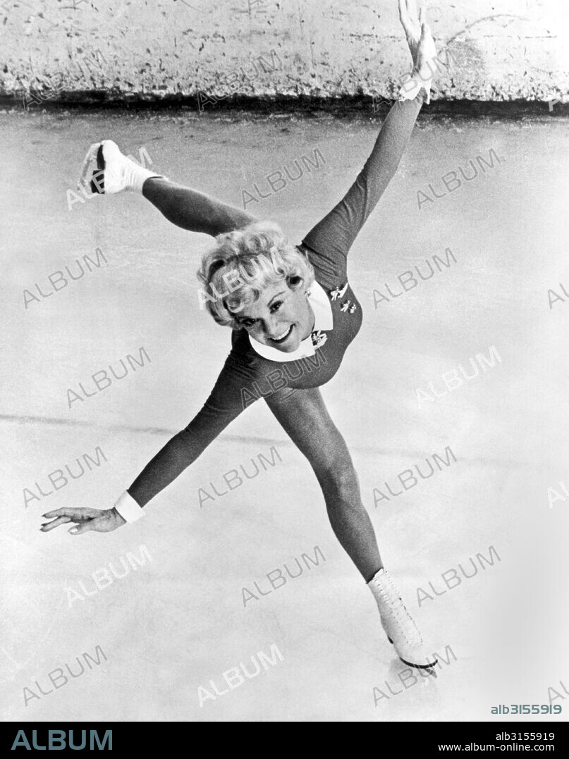 c. 1955.  Sonia Henie, championship skater and actress, shows her remarkable and graceful style in this  photograph.