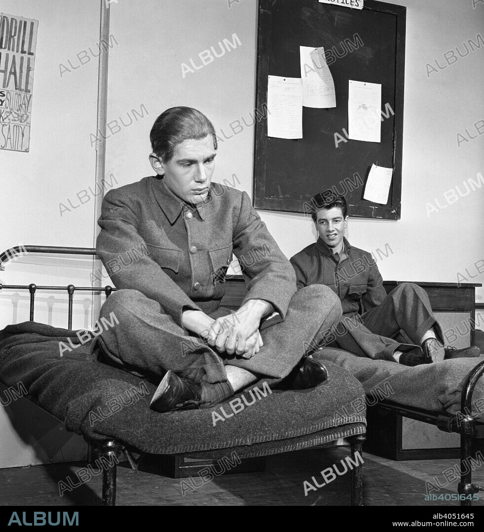 A scene from the Terence Rattigan play, Ross, Worksop College, Nottinghamshire, 1963. The play is a biographical play of TE Lawrence (Lawrence of Arabia). Some of the play is set in flashback and is centered around the exploits of Lawrence in the deserts of the Middle East during the First World War, where the character first appears as 'Aircraftsman Ross'. The cast were members of the theatrical group at Worksop College.