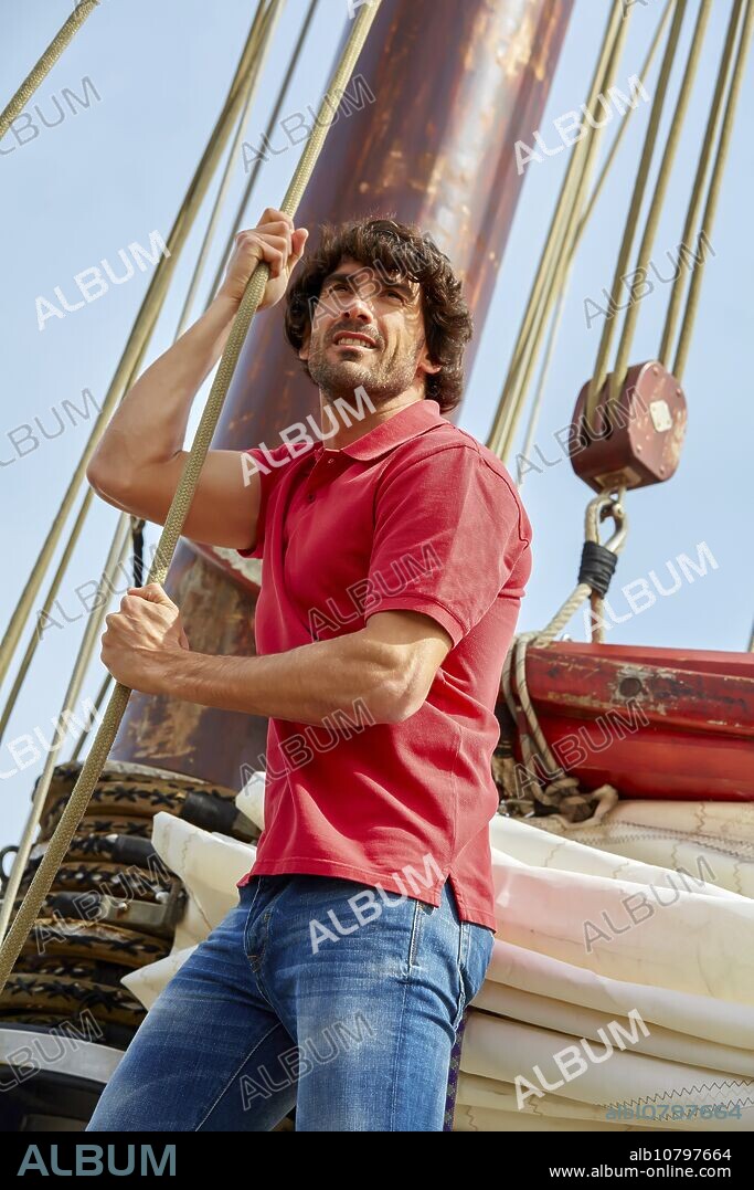 Sailor. Ropes sail of a sailboat, galleon. Basque Country. Spain.