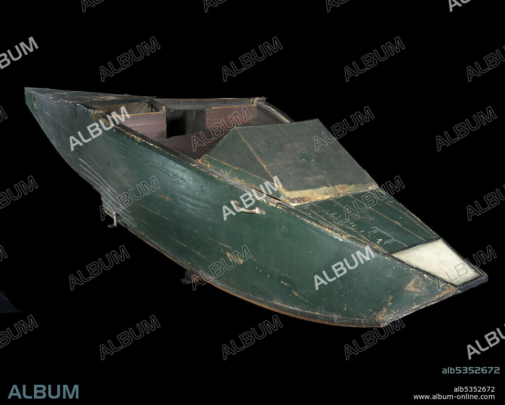 CURTISS AEROPLANE AND MOTOR COMPANY. Hull of a Curtiss Model E Flying Boat. Full-size aircraft was a single-engine, two-seat, biplane with a pusher engine mounted above and behind the pilot between the wings; 90-horsepower Curtiss OX V8 engine. Dark green finish. In 1911, Glenn Curtiss was awarded the prestigious Collier Trophy for the development of the hydroaeroplane, a land airplane mounted on floats. In 1913, Curtiss developed the first practical and highly successful flying boat, the Model E, with the entire fuselage being a hull rather than mounting the aircraft on floats. The later Model F perfected the flying boat design with the incorporation of a V hull, supplanting the less efficient flat-bottomed hull of the Model E. Among the Curtiss Model E Flying Boats produced in 1913 was one sold to Logan A. "Jack" Vilas of Chicago. Vilas' Model E was powered by a 90-horsepower Curtiss OX engine. With this aircraft, Vilas made the first crossing of Lake Michigan, flying from St. Joseph, Michigan, to Grant Park on Chicago's waterfront in July 1913. Vilas donated the hull of his Model E Flying Boat to the Smithsonian Institution in 1949. Nothing else of the aircraft survives.