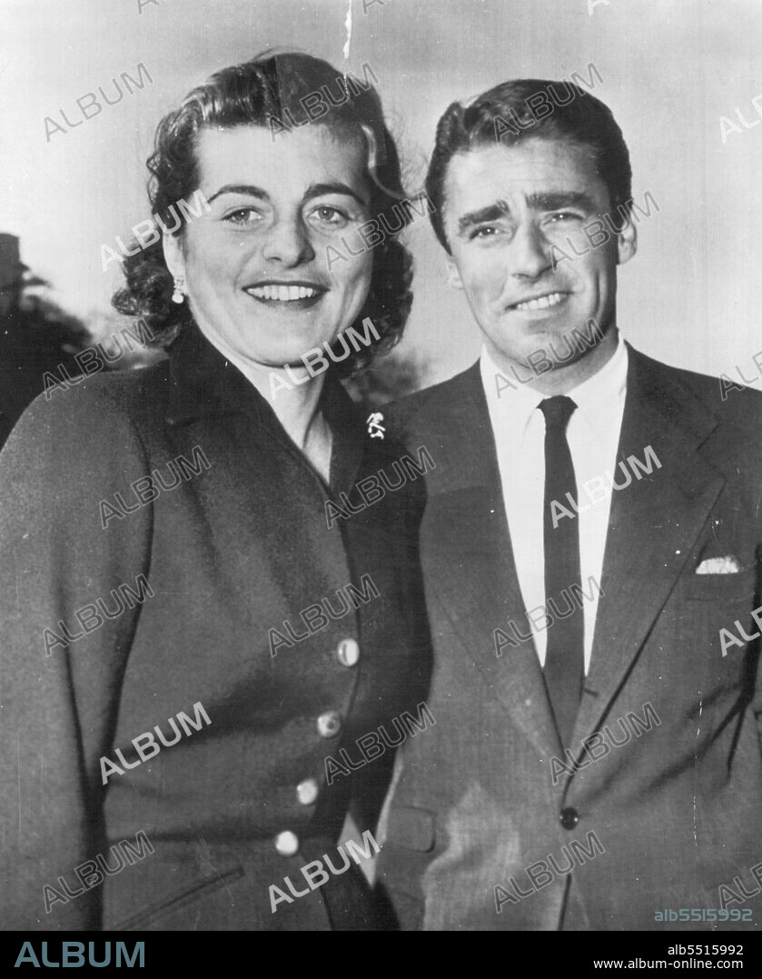 Up In Central Park -- Peter Lawford, screen actor, and his fiancee, Patricia Kennedy take advantage of the balmy weather by taking a stroll in Central Park here today. Their engagement was announced in Palm Beach, Fla., Feb. 12, by the bride-to-be's father, former U.S. Ambassador to the Court of St. James's, Joseph P. Kennedy, and her mother. The wedding is expected to take place soon after Easter. Miss Kennedy is a sister of Senator John F. Kennedy of Massachusetts. February 18, 1954. (Photo by AP Wirephoto).