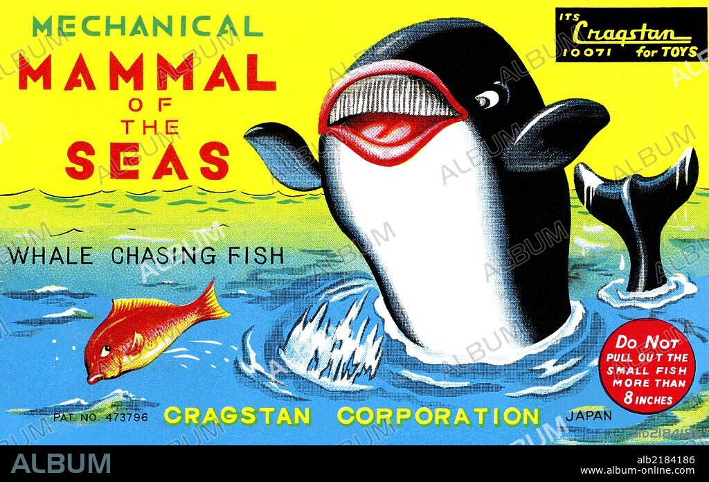 A smiling whale chases fish for pleasure.  This graphic art is from an antique Japanese tin children's toy.  Often the box art was much more enjoyable than the toy inside.