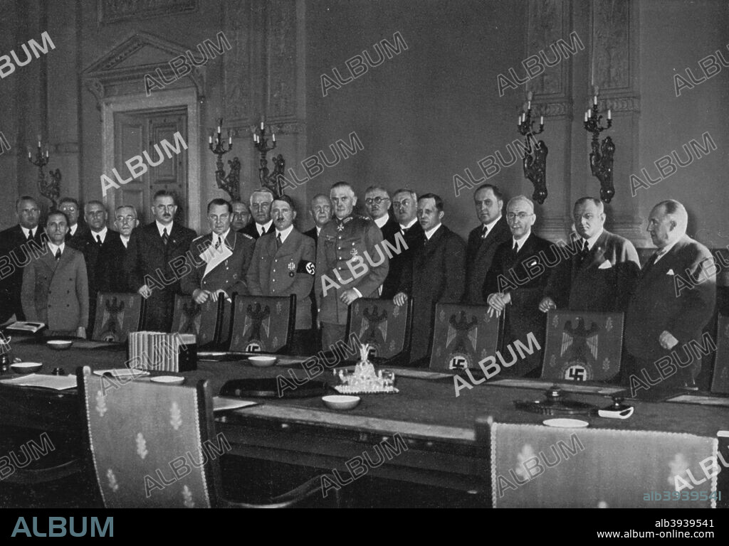 Adolf Hitler and his cabinet, 1936. German Nazi Chancellor Hitler (1889-1945) with Hermann Goering (1893-1946) and other members of his cabinet. A print from Adolf Hitler. Bilder aus dem Leben des Führers, Hamburg: Cigaretten/Bilderdienst Hamburg/Bahrenfeld, 1936.