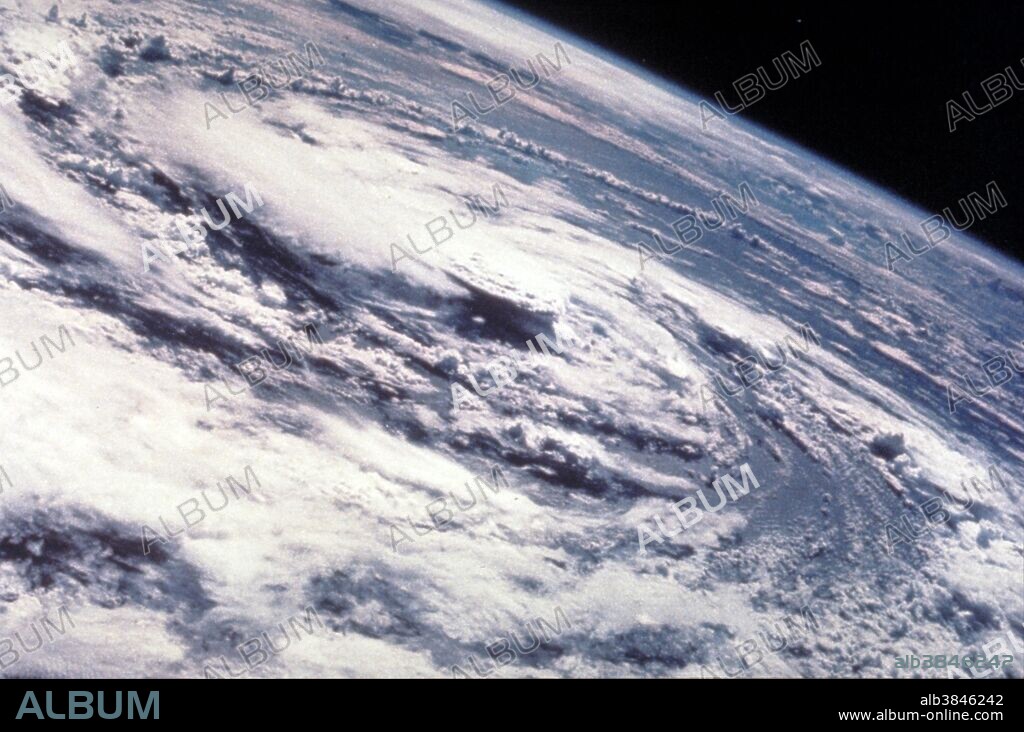 Hurricane Gladys, Gulf of Mexico, as seen from the Apollo 7 spacecraft during its 91st revolution of the earth. Photographed from an altitude of 99 nautical miles, at ground elapsed time of 144 hours and 27 minutes. Hurricane Gladys was the farthest tropical cyclone from the United States to be observed by radar in the Atlantic basin since Hurricane Carla in 1961. The seventh named storm and fifth hurricane of the 1975 Atlantic hurricane season, Gladys developed from a tropical wave while several hundred miles southwest of Cape Verde on September 22. Initially, the tropical depression failed to strengthened significantly, but due to warm sea surface temperatures and low wind shear, it became Tropical Storm Gladys by September 24. Despite entering a more unfavorable environment several hundred miles east of the northern Leeward Islands, Gladys became a Category 1 hurricane on the Saffir-Simpson hurricane wind scaleon September 28. Shortly thereafter, the storm reentered an area favorable for strengthening. Eventually, a well-defined eye became visible on satellite imagery.