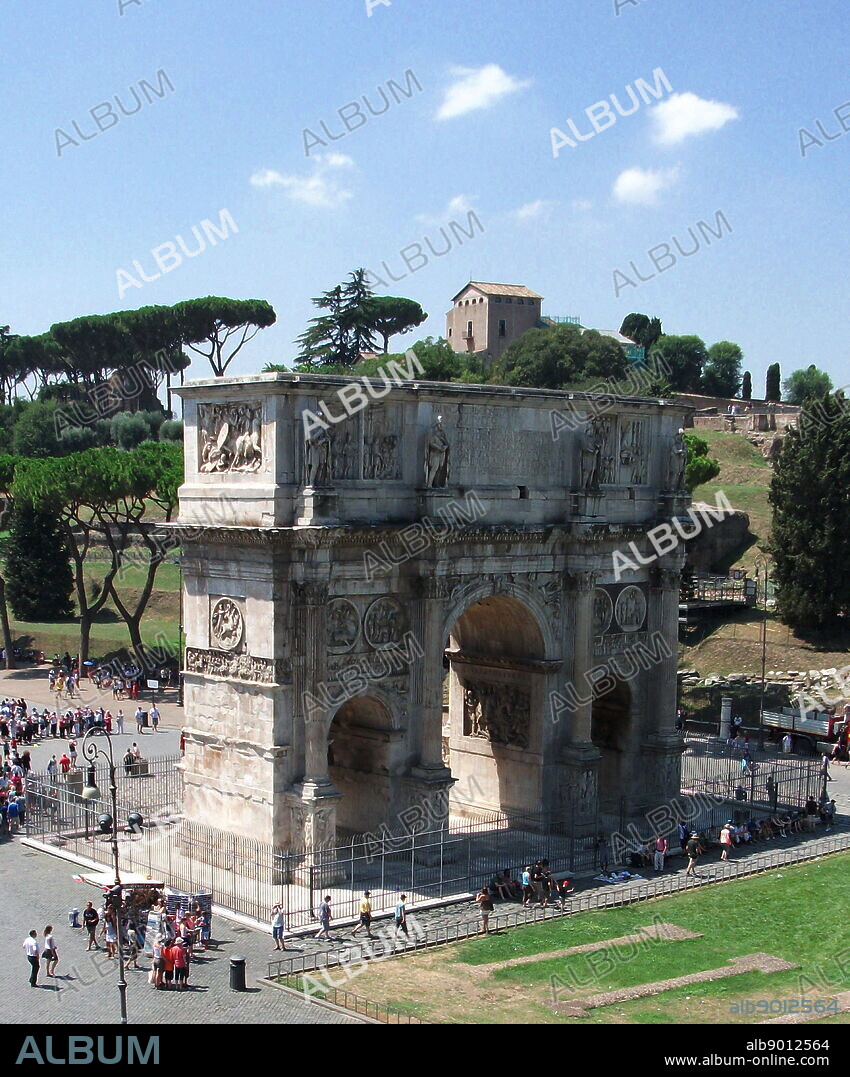 The Arch of Constantine, a triumphal, or victory arch in Rome. It is positioned between the Collosseum and the Palatine Hill. It commemorates Emperor Constantine's victory in the Battle of Milvian Bridge in the early 4th century AD. It was dedicated in 315 AD and features reliefs/friezes documenting previous Emperors and victory figures.