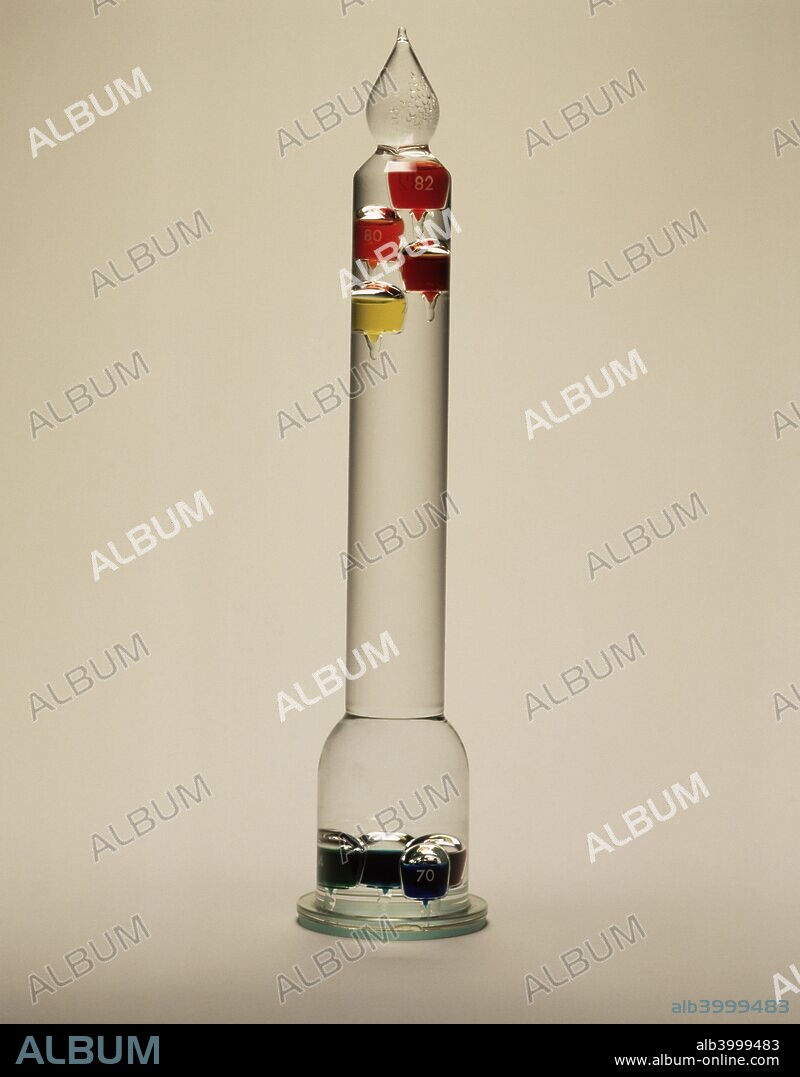 'Galileo's thermometer', 1592. A 1994 copy of the air thermometer made by Galileo Galilei, the celebrated Italian scientist. This was probably the first instrument made for the measurement of temperature and consisted of a long thin glass tube fitted with a number of glass balls weighted to be of different densities in a liquid and arranged to sink one after the other as the temperature rose. This thermometer is more accurately known as a 'termometro infingardo'.