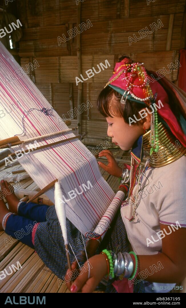 Thailand: Padaung (Long Neck Karen) girl weaving, Chiang Mai Province, northern Thailand. The Padaung or Kayan Lahwi or Long Necked Karen are a subgroup of the Kayan, a mix of Lawi, Kayan and several other tribes. Kayan are a subgroup of the Red Karen (Karenni) people, a Tibeto-Burman ethnic minority of Burma (Myanmar).