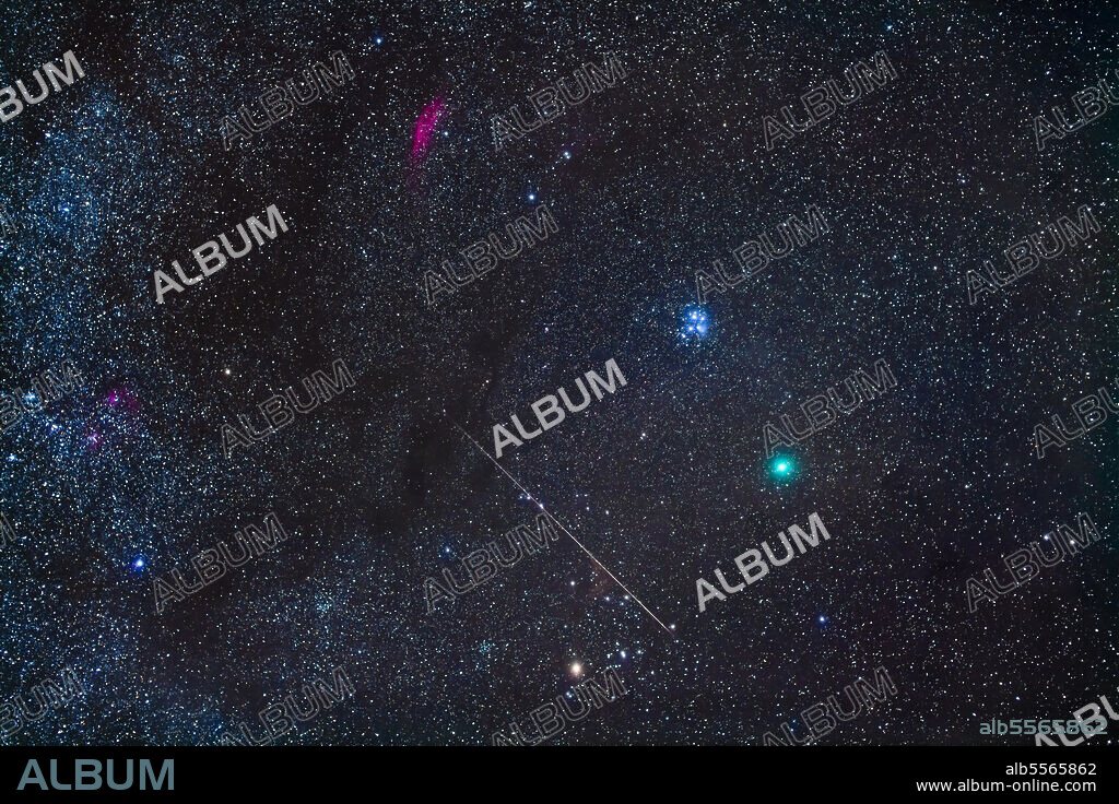This is Comet Wirtanen 46P in Taurus on December 14/15, 2018 accompanied by a meteor, caught by chance of course. The meteor has left a yellowish smoke cloud. Yellowish Aldebaran and the Hyades are at bottom, the pink California Nebula (NGC 1499) is at top, in Perseus, while the blue Pleiades are at centre. They form a nice colour contrast with the cyan-green comet. The Taurus Dark Clouds of interstellar dust are at left. Comet Wirtanen was two days before its closest approach to Earth and nearly at its brightest. It was visible to the unaided eye.