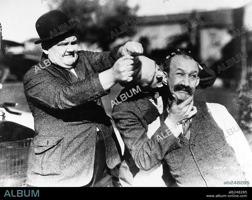 JAMES FINLAYSON, OLIVER HARDY and STAN LAUREL in BIG BUSINESS, 1929, directed by JAMES W. HORNE. Copyright M.G.M.