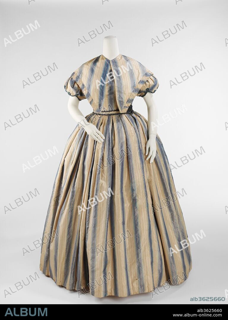 Evening dress. Culture: American. Date: ca. 1848.
The female silhouette of the middle of the 19th century consisted of a fitted corseted bodice and wide full skirts.  The conical skirts developed between the 1830s, when the high waist of the Empire silhouette was lowered and the skirts became more bell shaped, to the late 1860s, when the fullness of the skirts were pulled to the back and the bustle developed.  The flared skirts of the period gradually increased in size throughout and were supported by a number of methods.  Originally support came from multiple layers of petticoats which, due to weight and discomfort, were supplanted by underskirts comprised of graduated hoops made from materials such as baleen, cane and metal.  The fashions during this time allowed the textiles to stand out because of the vast surface areas of the skirt and a relatively minimal amount of excess trim.