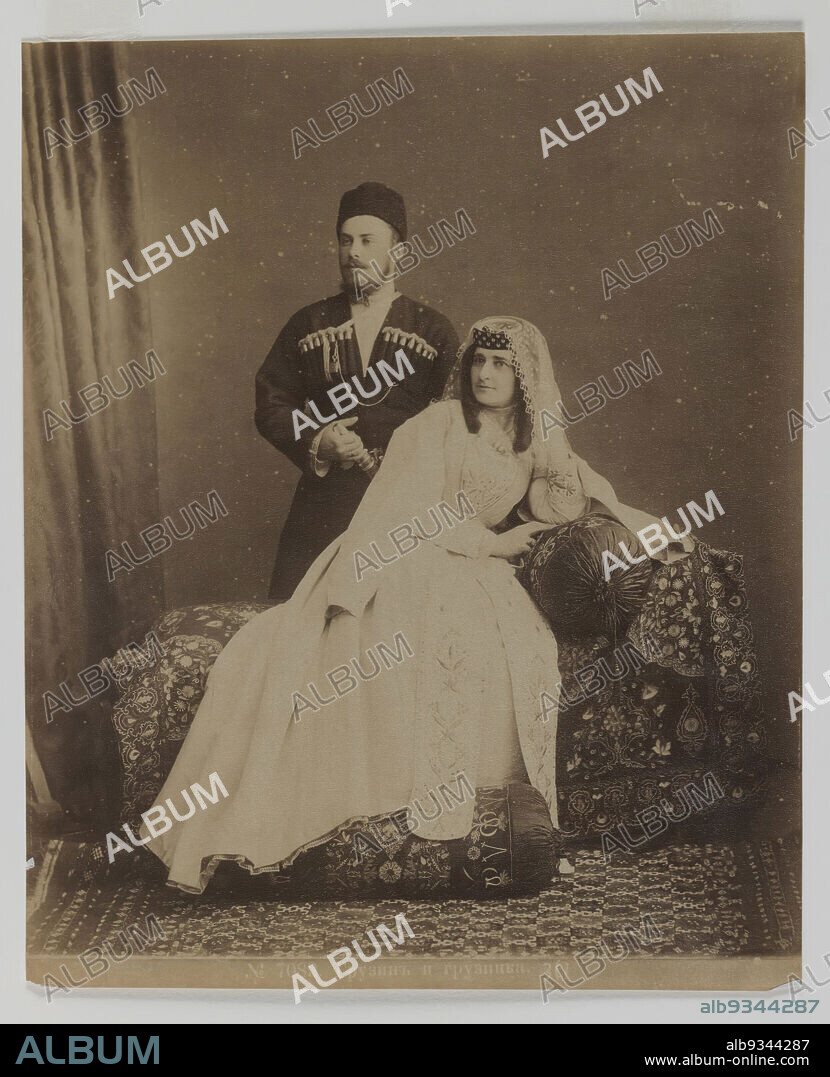 Albumen silver photograph, 19th century, Qajar, Qajar Period, 13 9/16 x 10 1/2 in., 34.4 x 26.7 cm, ceremony, couch, couple, family, husband, Iran, love, marraige, marriage, matrimony, Persia, photography, portrait, Qajar, romance, studio, veil, wedding, wife.