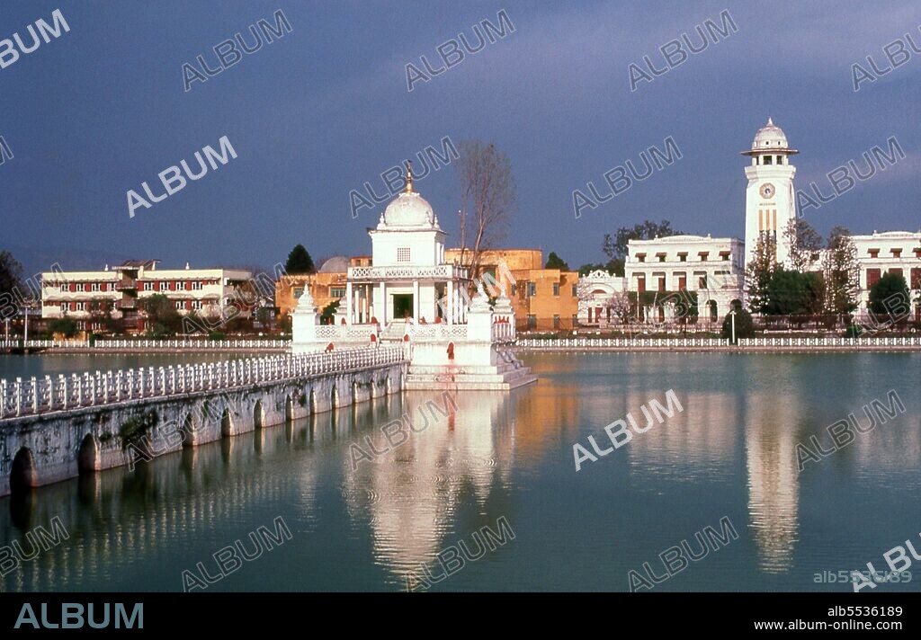 Rani Pokhari (Queen’s Pond), located off the northern end of the Tundikhel, is one of Kathmandu’s more attractive landmarks. The pond was dug between 1665 and 1670 by King Pratapa Malla to comfort his wife Bhavan Lakshmi over the death of their son Chakrabatindra Malla who had been trampled to death by an elephant. In later years, the pond was used for trial by ordeal, in which the representatives of two conflicting parties had to submerge themselves in the water, the one with the greater lung capacity winning the case. With the beginning of Rana rule the ordeals were discontinued.