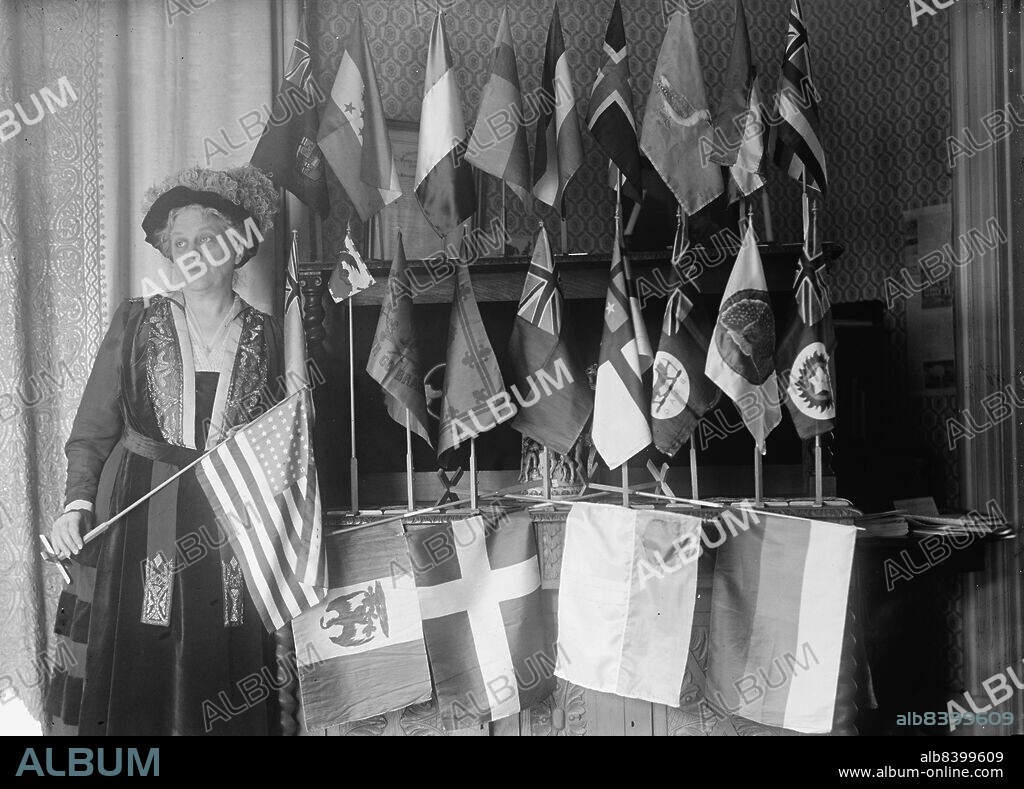 HARRIS & EWING. Mrs. Carrie Chapman Catt with Flags of 22 Nations, 1917. American women's suffrage campaigner, president of the National American Woman Suffrage Association, founded the League of Women Voters, involved in Women's Action Committee for Victory and Lasting Peace, dedicated to giving support to the idea of the United Nations.