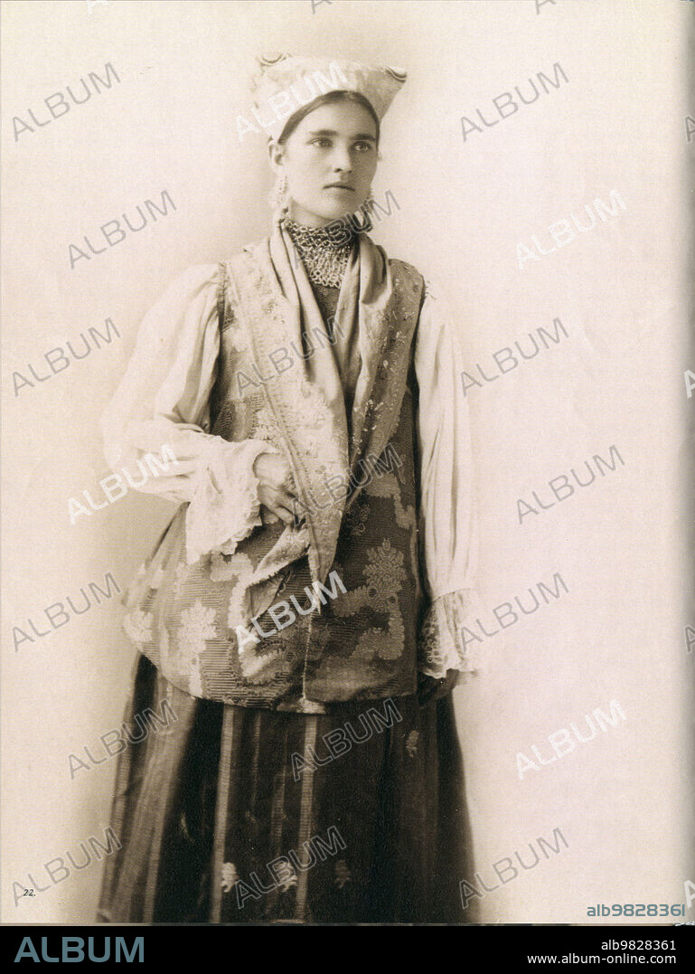 Young Russian woman from Northern Russia, Novgorod province in traditional folk dress ca. before 1917.