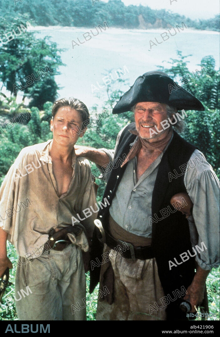 CHARLTON HESTON and CHRISTIAN BALE in TREASURE ISLAND, 1990, directed by FRASER HESTON. Copyright WARNER BROTHERS.