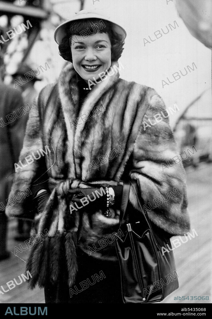Film Award Winner Here - Pictured aboard the Cunard White Star liner "Queen Mary" on arrival at Southampton, is Hollywood film actress Jane Wyman, winner of an Academy award for her brilliant performance in the film 'Johnny Belinda'. Jane, who is wearing a far cape with waist-belt, and "little-girl" hat, is here to make "Stage Fright" Which will be directed by Alfred Hitchcock. May 11, 1949.