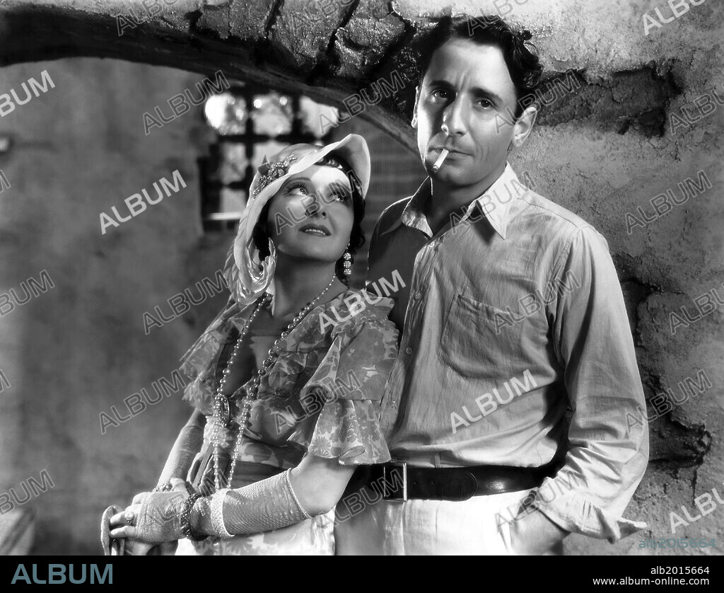 VICTOR JORY and VIVIENNE OSBORNE in THE DEVIL'S IN LOVE, 1933, directed by WILHELM DIETERLE. Copyright FOX FILMS.