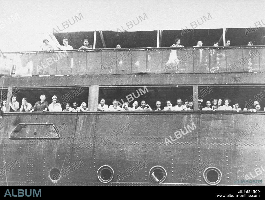 Jewish refugees aboard the 'SS St Louis' attempt to communicate with friends and relatives in Cuba, who were permitted to approach the docked vessel in small boats. The passengers were not allowed to disembark.